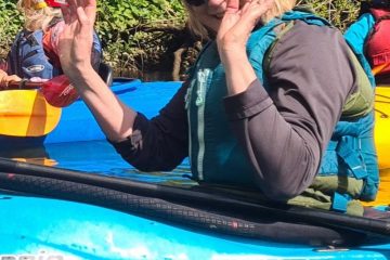 waving kayaker