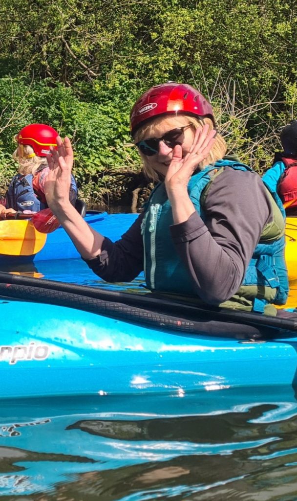 waving kayaker